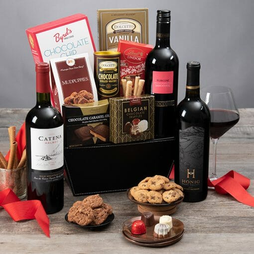A keepsake gift basket with wine, dark chocolate and other snacks