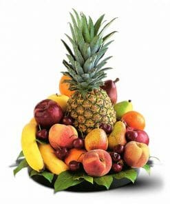 A gift basket filled with various fruits in season. Pineapple, bananas, peaches, apples, pears, oranges and more.